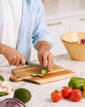 Zulay Kitchen Cutting Boards Collection - Slicing zucchini on a cutting board.